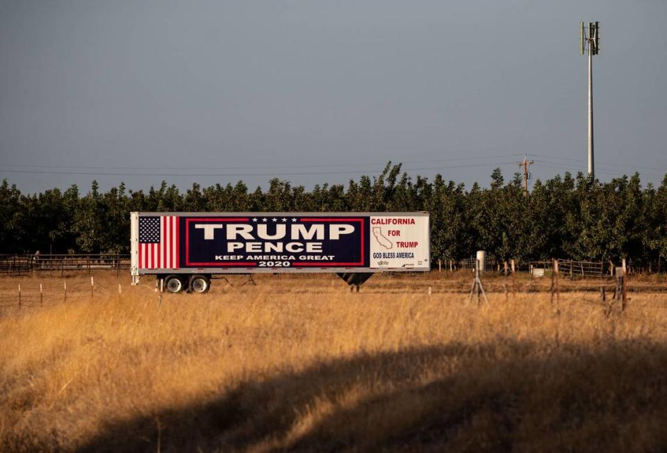 A campaign sign supporting the re-election of Donald Trump hangs on a trailer near Interstate 5 in Tehama County on Thursday, Oct. 22.