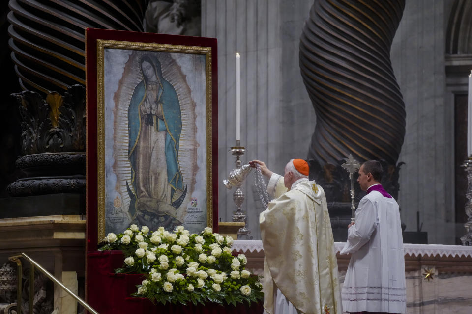 Cardinal Marc Ouellet asperges incense on a picture of our lady of Guadalupe during a mass in her honor presided over by Pope Francis in St. Peter's Basilica at The Vatican, Monday, Dec. 12, 2022. (AP Photo/Gregorio Borgia)
