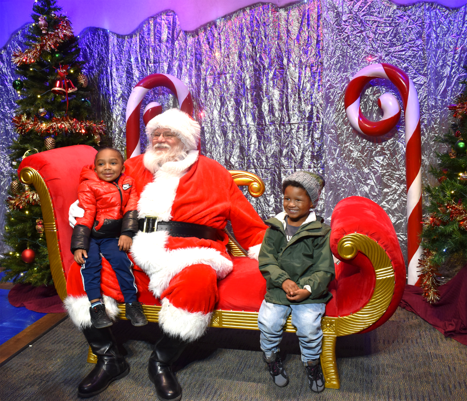 Santa poses for pictures with guests at a previous Wild Lights at the Akron Zoo.