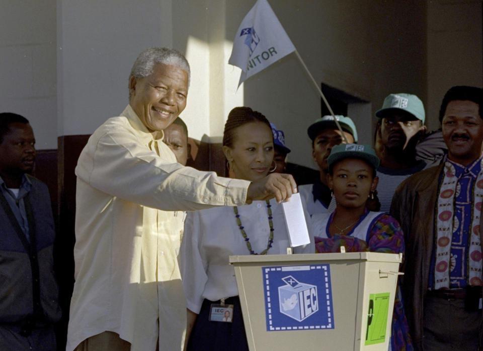 FILE - Then African National Congress leader, Nelson Mandela casts his vote April 27, 1994 near Durban, South Africa, in the country's first all-race elections. South Africans celebrate "Freedom Day" every April 27, when they remember their country's pivotal first democratic elections in 1994 that announced the official end of the racial segregation and oppression of apartheid. (AP Photo/John Parkin. File)