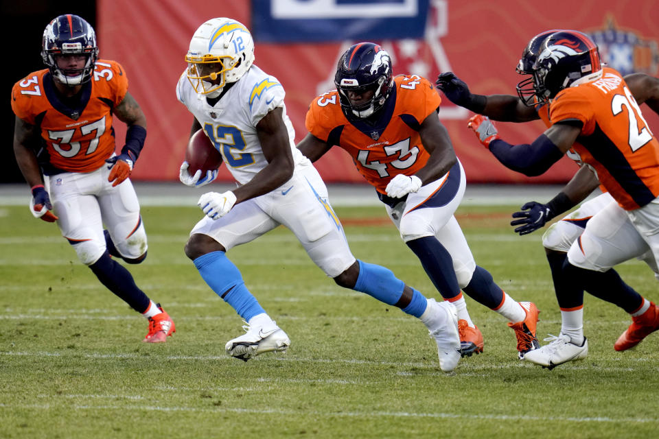 Los Angeles Chargers wide receiver Joe Reed (12) is pursued by Denver Broncos linebacker Joe Jones (43) during the second half of an NFL football game, Sunday, Nov. 1, 2020, in Denver. (AP Photo/Jack Dempsey)