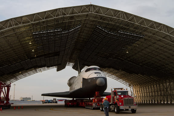 The space shuttle Enterprise, mounted on transport vehicle, is seen under a hanger at John F. Kennedy (JFK) International Airport in New York.