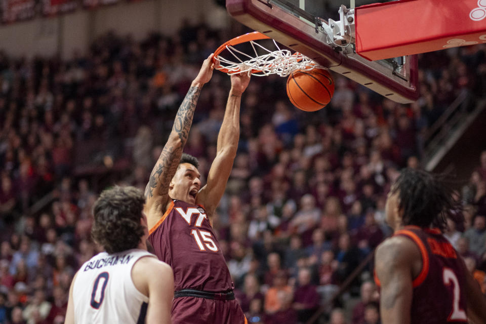 Virginia Tech's Lynn Kidd dunks against Virginia during the first half of an NCAA college basketball game, Monday, Feb. 19, 2024, in Blacksburg, Va. (AP Photo/Robert Simmons)