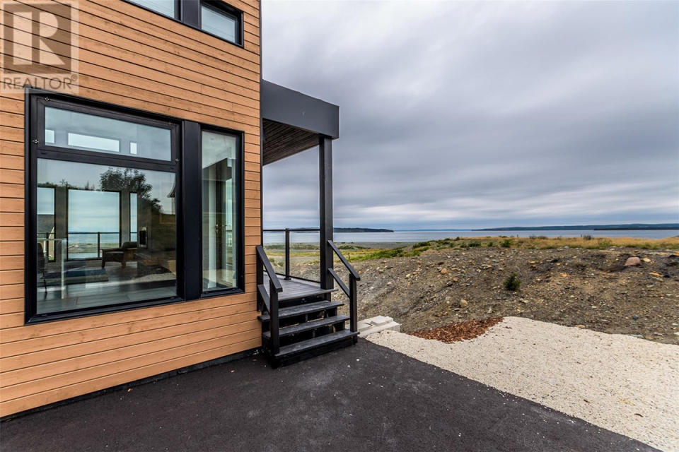 <p><a rel="nofollow noopener" href="https://www.zoocasa.com/conception-bay-south-nl-real-estate/5332710-8-commodore-place-conception-bay-south-nl-a1w0a9-1175937" target="_blank" data-ylk="slk:8 Commodore Place, Conception Bay, Nfld.;elm:context_link;itc:0;sec:content-canvas" class="link ">8 Commodore Place, Conception Bay, Nfld.</a><br> Outside you’ll find an additional 600 square feet of living space, with a covered barbecue area and large viewing deck.<br> (Photo: Zoocasa) </p>