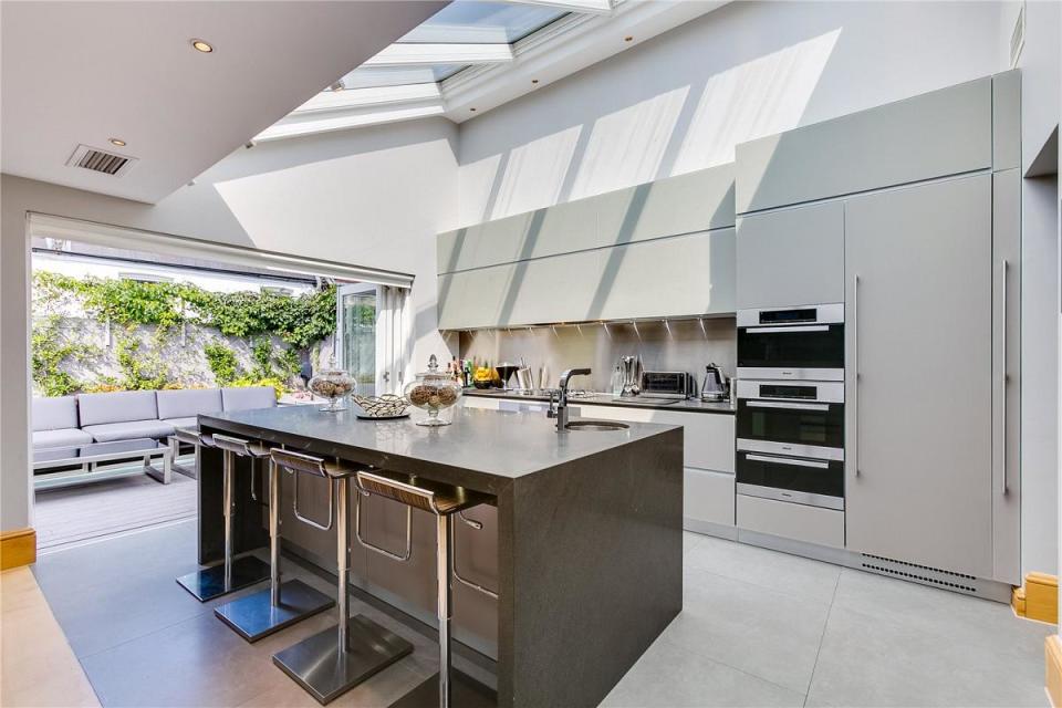 <p>You could certainly ‘breakfast like a champion’ in this super sleek, bespoke Italian kitchen. </p>