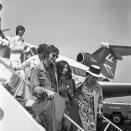 <p>John Lennon and Yoko Ono disembark from a small plane in 1971 as they arrive in France for the Cannes Film Festival, shortly after Lennon announced his departure from The Beatles. </p>