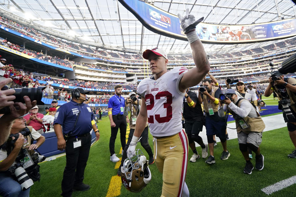 San Francisco 49ers running back Christian McCaffrey waves to fans as he walks off the field after the 49ers defeated the Los Angeles Rams 31-14 in an NFL football game Sunday, Oct. 30, 2022, in Inglewood, Calif. (AP Photo/Ashley Landis)