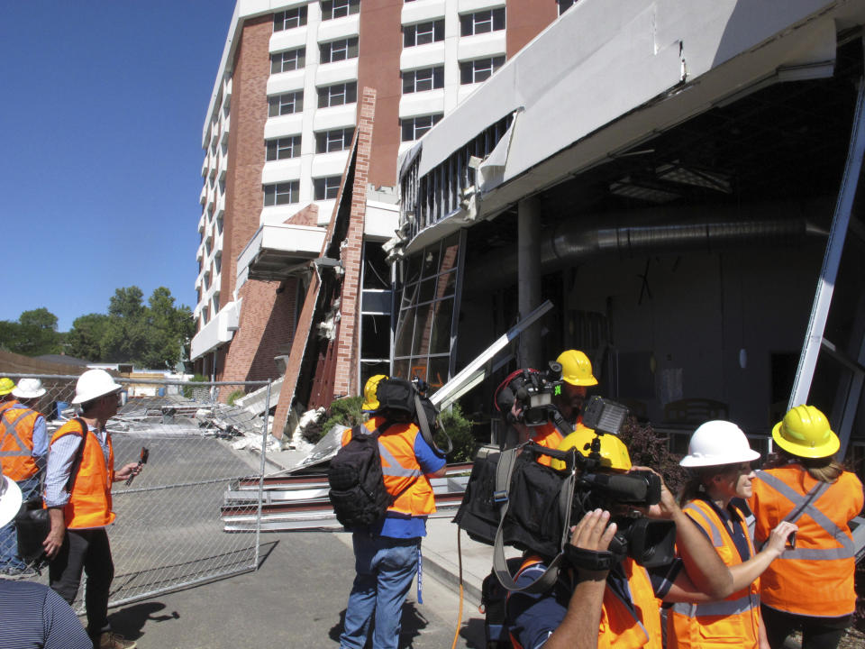 Members of the media got their first up-close look on Thursday, July 11, 2019, in Reno, Nev., at the exterior and interior damage at a University of Nevada, Reno dormitory where a natural gas explosion blew out walls and windows on July 5. Structural engineers with experience responding to earthquakes and natural disasters are helping with efforts to rebuild it over the next year or so. Eight people suffered minor injuries in the blast at the mostly empty Argenta Hall. (AP Photo/Scott Sonner)