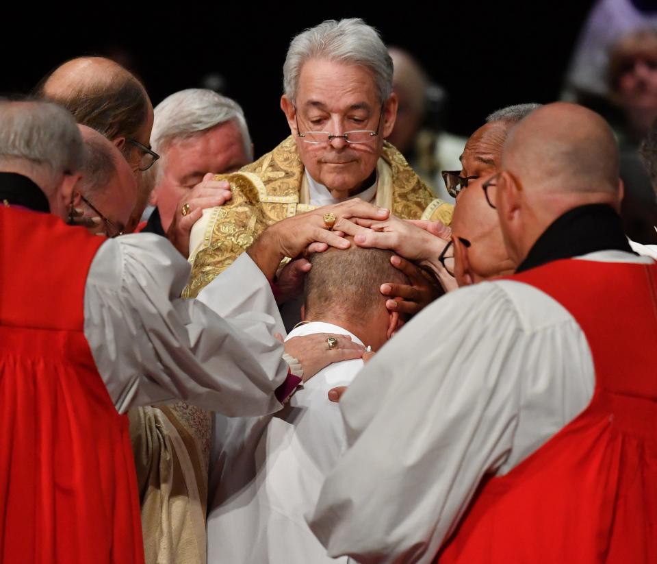 Episcopal and Lutheran bishops from around the country participate in the traditional laying-on of hands to consecrate Rev. Dr. Douglas F. Scharf as a new bishop of The Episcopal Church on Saturday, Sept. 24, 2022 at Van Wezel Performing Arts Hall in Sarasota.