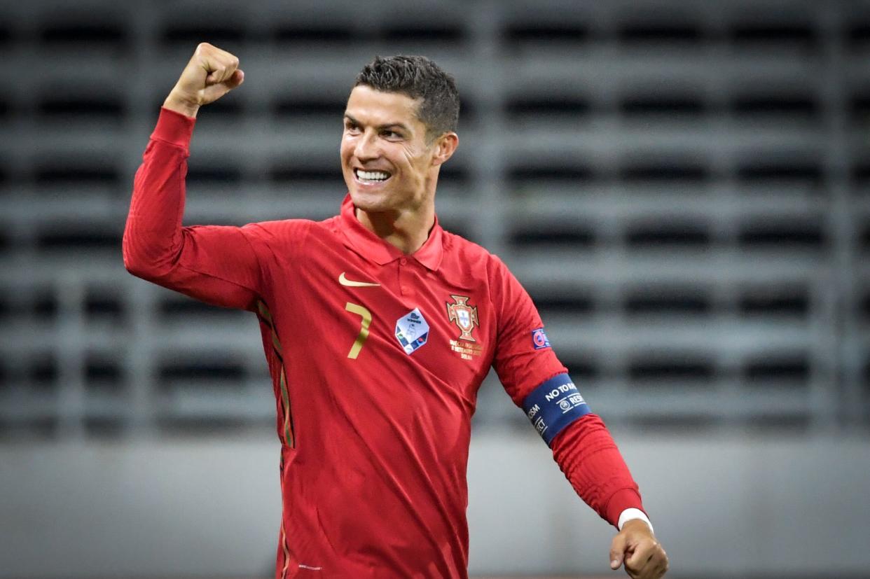 Cristiano Ronaldo celebrates scoring his 100th goal for Portugal. (Janerik Henriksson/Getty Images)