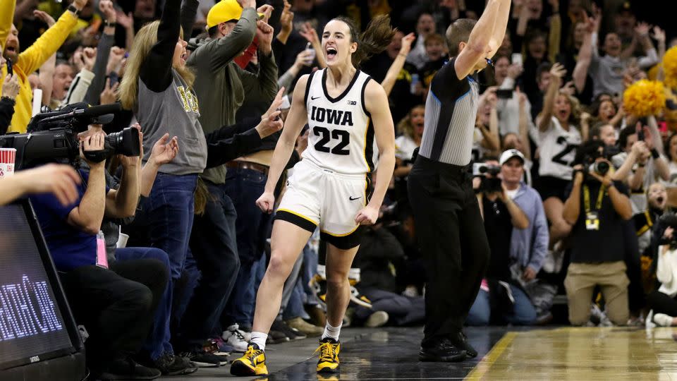 Caitlin Clark of the Iowa Hawkeyes celebrates after breaking the NCAA women's all-time scoring record last month. - Matthew Holst/Getty Images