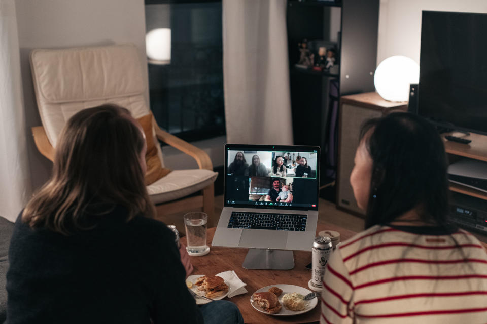 NEW YORK, NY - NOVEMBER 22: A couple celebrates Thanksgiving with friends by having dinner together over a Zoom video call on November 22, 2020 in New York City. As new COVID-19 cases continue to rise across America, many are forgoing holiday travel and traditional family gatherings out of concern for spreading the virus. (Photo by Scott Heins/Getty Images)