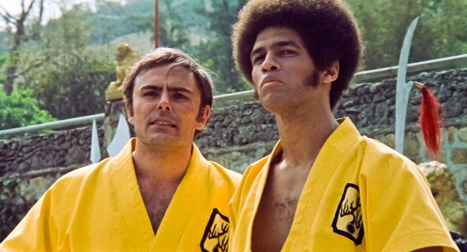 USA. Jim Kelly and John Saxon  in a scene from (C)Warner Bros  film: Enter The Dragon (1973). Plot: A secret agent comes to an opium lord's island fortress with other fighters for a martial-arts tournament.  Ref: LMK110-J7156-020621 Supplied by LMKMEDIA. Editorial Only. Landmark Media is not the copyright owner of these Film or TV stills but provides a service only for recognised Media outlets. pictures@lmkmedia.com