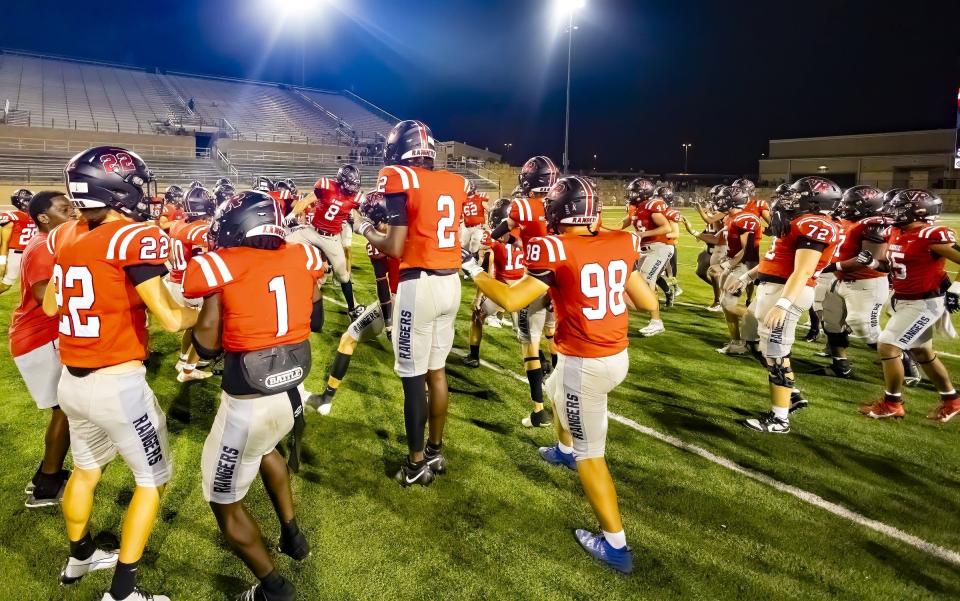 Vista Ridge players charge to the center in a traditional ring-up win celebration after beating the Georgetown Eagles on Sept. 1 at Gupton Stadium. The regular season is nearly halfway done as we enter this week's high school games.