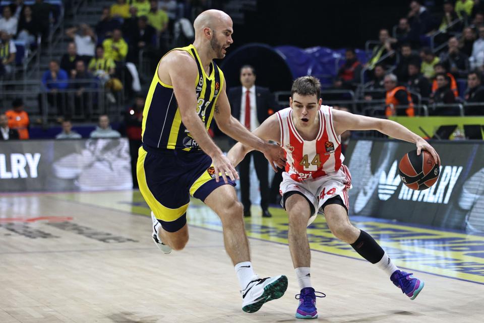 Nikola Topic of Crvena Zvezda Meridianbet Belgrade dribbles against Nick Calathes of Fenerbahce Beko Istanbul during EuroLeague action at Ulker Sports Arena, Jan. 2, 2024 in Istanbul, Turkey.