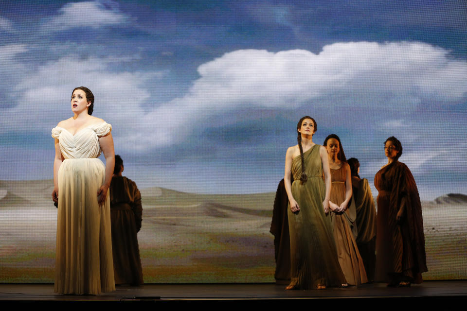 In this April 12, 2013 photo provided by the New York City Opera, soprano Sian Davies, left, sings the role of Elcia with Emily Righter, center right, in the role of Amenofi during the New York City Opera's final dress rehearsal of Rossini's rarely performed "Mose in Egitto (Moses in Egypt)," at the City Center in New York. (AP Photo/New York City Opera, Carol Rosegg)