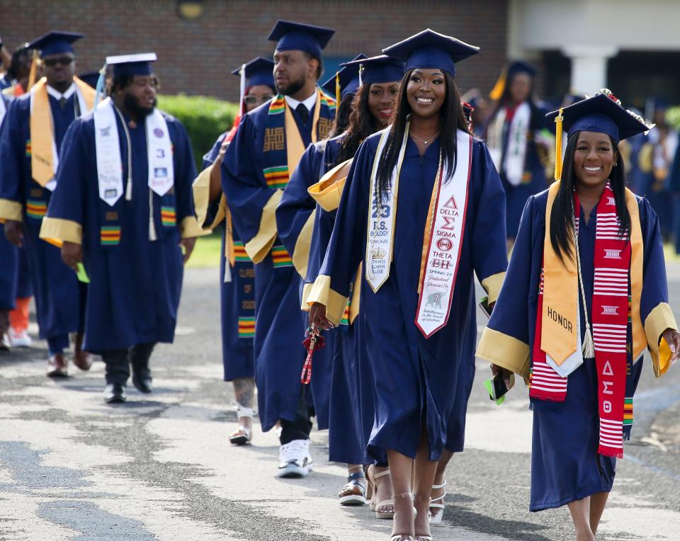 Stillman College graduates react to family and friends as they enter the football stadium for graduation Saturday May 6, 2023, at Stillman College. 