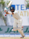 Cricket - Sri Lanka v India - First Test Match - Galle, Sri Lanka - July 26, 2017 - India's cricketer Cheteshwar Pujara plays a shot. REUTERS/Dinuka Liyanawatte