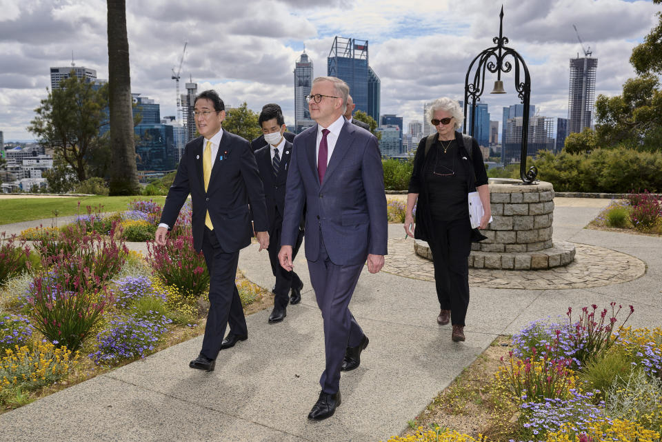 Japan's Prime Minister Fumio Kishida, left, walks with Australian Prime Minister Anthony Albanese during a visit to Kings Park in Perth, Australia, Saturday, Oct. 22, 2022. Kishida visit is to bolster military and energy cooperation between Australia and Japan amid their shared concerns about China. (Stefan Gosatti/Pool Photo via AP)