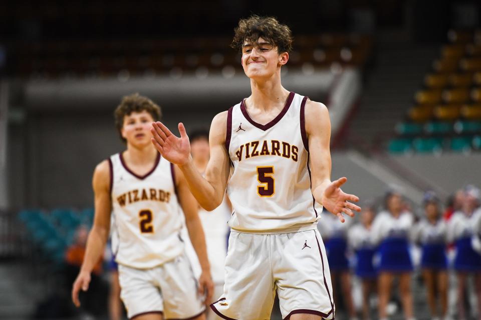 Windsor boys basketball player Madden Smiley (5) claps after making a free throw against Longmont during the quarterfinals of the Colorado 5A state basketball tournament on March 2 at the Denver Coliseum.