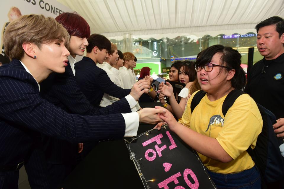 PHOTOS: Crowds brave rain to see K-pop group Monsta X at Plaza Singapura