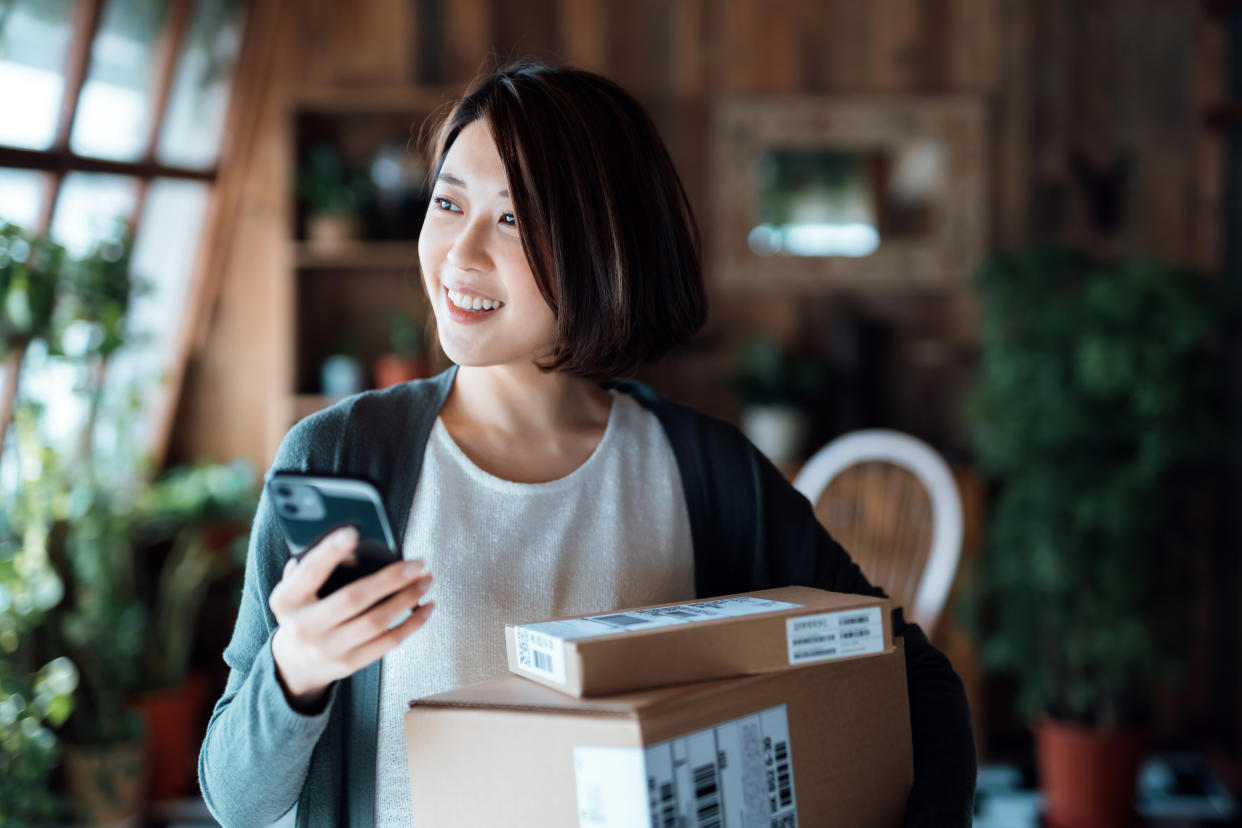 Woman receiving parcels after shopping online. Photo: iStock