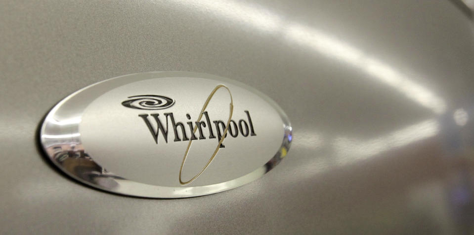 FILE - In this July 20, 2009 file photo, the Whirlpool logo appears on the face of a refrigerator for sale at the Sears Grand store in Solon, Ohio. Whirlpool said Friday, Aug. 28, 2009, it will cut 1,100 jobs and close a refrigerator factory in Evansville, Ind. (AP Photo/Amy Sancetta, file)