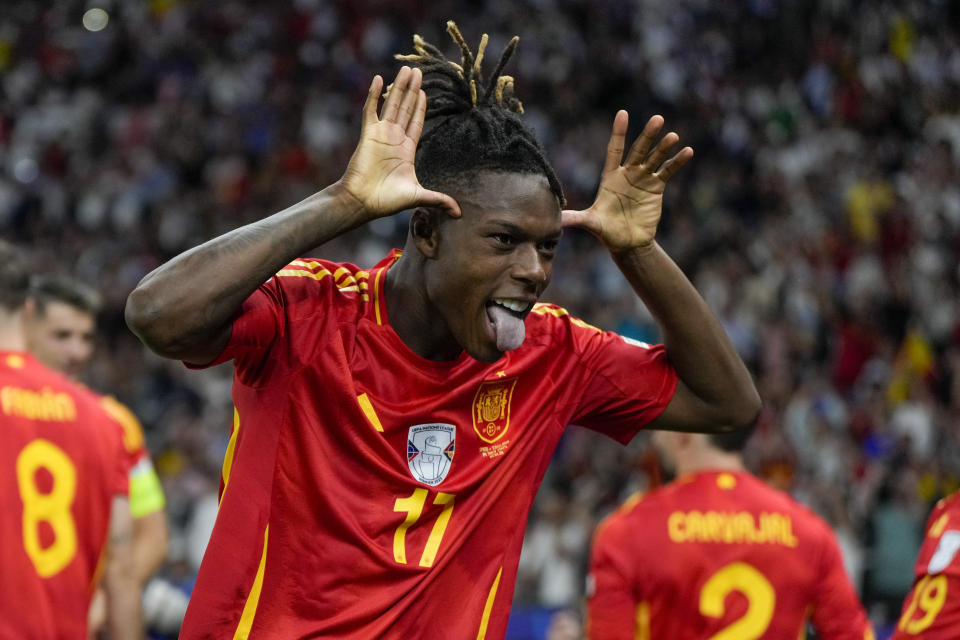 Spain's Nico Williams celebrates after scoring his side's opening goal during the final match between Spain and England at the Euro 2024 soccer tournament in Berlin, Germany, Sunday, July 14, 2024. (AP Photo/Matthias Schrader)