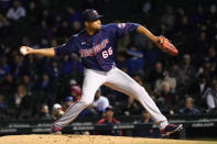 Minnesota Twins relief pitcher Jorge Alcala delivers during the eighth inning of a baseball game against the Chicago Cubs Wednesday, Sept. 22, 2021, in Chicago. (AP Photo/Charles Rex Arbogast)