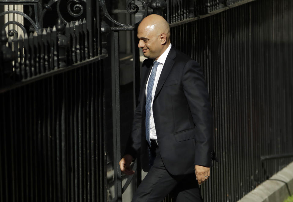 Conservative lawmaker Sajid Javid arrives at 10 Downing Street, London, Wednesday, July 24, 2019. Boris Johnson has replaced Theresa May as Prime Minister, following her resignation last month after Parliament repeatedly rejected the Brexit withdrawal agreement she struck with the European Union. Johnson seems to be clearing out top ministers, firing several members of former leader Theresa May's Cabinet. (AP Photo/Matt Dunham)