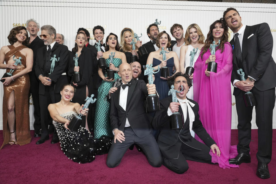 Aubrey Plaza, from back left, Bruno Gouery, Michael Imperioli, F. Murray Abraham, Beatrice Granno, Will Sharpe, Adam DiMarco, Simona Tabasco, Jennifer Coolidge, Federico Ferrante, Eleonora Romandini, Leo Woodall, Meghann Fahy, Sabrina Impacciatore, Theo James, Haley Lu Richardson, from bottom left, Jon Gries, Paolo Camilli, and Francesco Zecca from the cast of "The White Lotus," winners of the award for outstanding performance by an ensemble in a drama series, pose in the press room at the 29th annual Screen Actors Guild Awards on Sunday, Feb. 26, 2023, at the Fairmont Century Plaza in Los Angeles. (Photo by Jordan Strauss/Invision/AP)