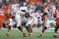 Clemson quarterback D.J. Uiagalelei (5) looks for a receiver during the fourth quarter of the team's NCAA football game against Syracuse in Syracuse, N.Y., Friday, Oct. 15, 2021. (AP Photo/Joshua Bessex)