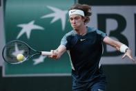 Russia's Andrey Rublev plays a shot against Chile's Cristian Garin during their third round match at the French Open tennis tournament in Roland Garros stadium in Paris, France, Saturday, May 28, 2022. (AP Photo/Thibault Camus)