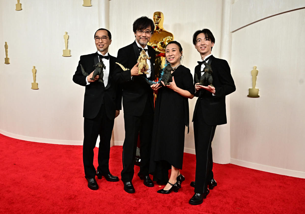 (From L) Masaki Takahashi, Japanese film director Takashi Yamazaki, Kiyoko Shibuya and Tatsuji Nojima attend the 96th Annual Academy Awards at the Dolby Theatre in Hollywood, California on March 10, 2024. (Photo by Frederic J. Brown / AFP) (Photo by FREDERIC J. BROWN/AFP via Getty Images)