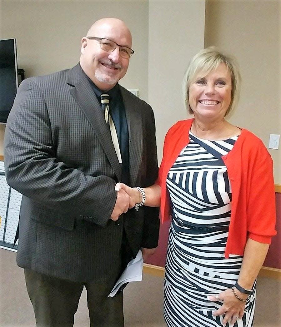 Patty Quessenberry, who spent 27 years on the Ozark school board, and former superintendent Kevin Patterson.