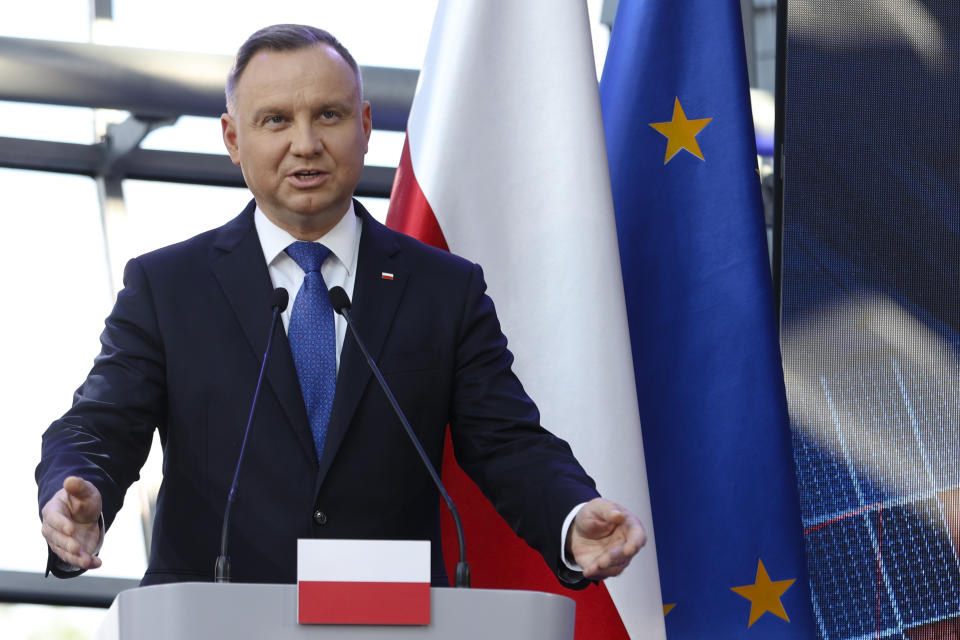 Polish President Andrzej Duda briefs the media during a joint news conference with European Commission President Ursula von der Leyen and Poland's Prime Minister Mateusz Morawiecki at the headquarters of Poland's Power Grid in Konstancin-Jeziorna, Poland, Thursday, June 2, 2022. The independence of Poland's courts is at the heart of a dispute with the European Union, which has withheld billions of euros in pandemic recovery funds. European Commission President Ursula von der Leyen meets Poland's leaders discuss the matter. (AP Photo/Michal Dyjuk)