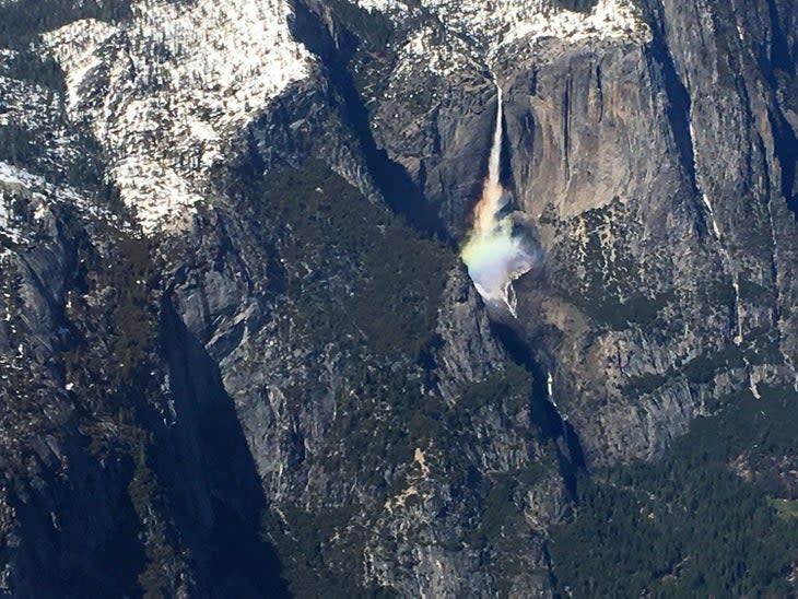 Flying over a waterfall's rainbow in Yosemite with Airborrn Aviatiion