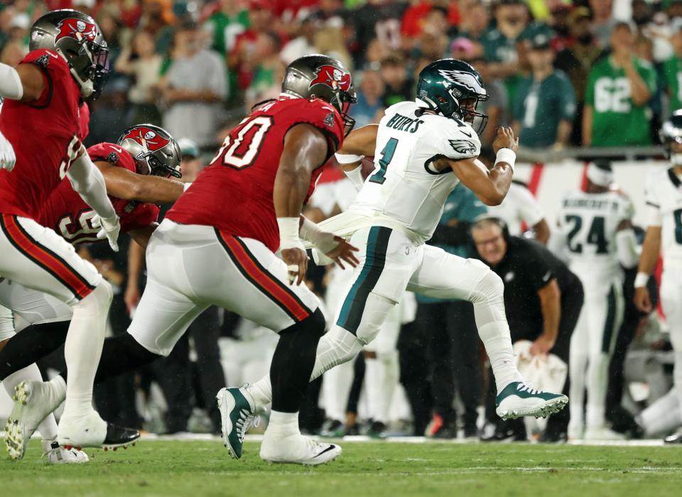 Philadelphia Eagles quarterback Jalen Hurts (1) runs with the ball against the Tampa Bay Buccaneers during the first half at Raymond James Stadium.