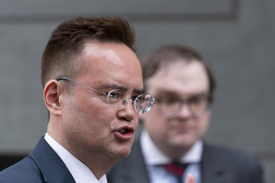 Nile Gardiner, director of the Margaret Thatcher Center for Freedom at The Heritage Foundation, with Samuel Dewey, right, speaks to reporters outside the federal courthouse in Washington, Tuesday, June 6, 2023. The Heritage Foundation, a Washington DC-based conservative think-tank, is suing Joe Biden's administration to force officials to release Prince Harry's immigration files, after the Duke of Sussex admitted to using illegal drugs. (AP Photo/Manuel Balce Ceneta)