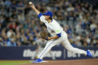 Toronto Blue Jays pitcher Kevin Gausman works against the Colorado Rockies during first-inning baseball game action in Toronto, Friday, April 12, 2024. (Frank Gunn/The Canadian Press via AP)