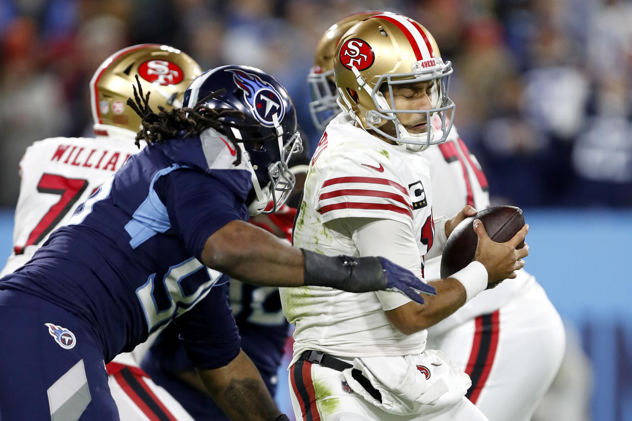 Jimmy Garoppolo of the San Francisco 49ers is sacked by Denico Autry of the Tennessee Titans. (Photo by Wesley Hitt/Getty Images)