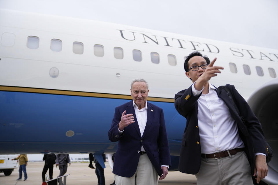 U.S. Senate Majority Leader Chuck Schumer, D-N.Y., left, and other members of the delegation arrive at Shanghai Pudong International Airport in Shanghai, China, Saturday, Oct. 7, 2023. (Aly Song/Pool Photo via AP)