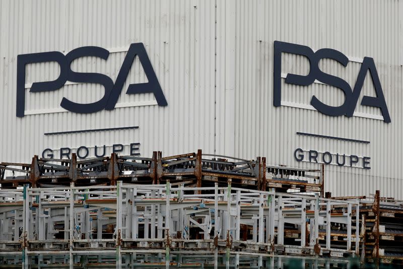 FILE PHOTO: The logo of PSA Peugeot Citroen is seen at the company's plant in Poissy, near Paris