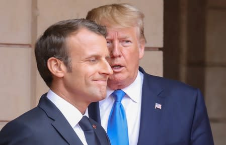 FILE PHOTO: U.S. President Donald Trump and French President Emmanuel Macron meet at the Prefecture of Caen, Normandy