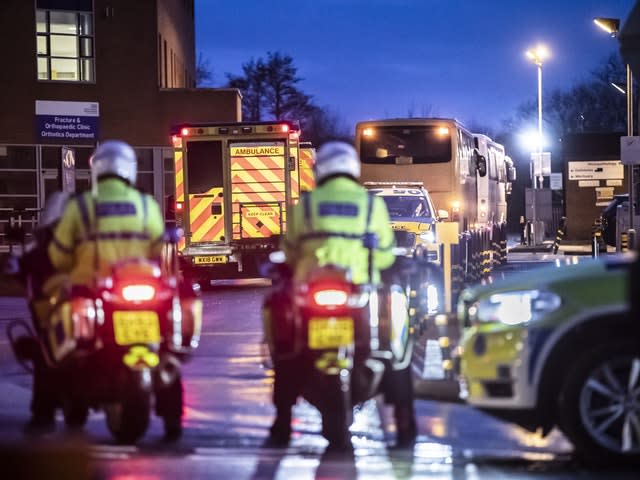 Coaches carrying passengers who were repatriated from Japan