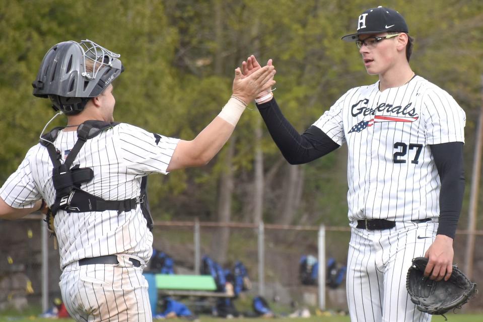 Catcher Ty Gallagher is the first to congratulate Herkimer College left-hander Greg Farone (27) after shutting out No. 1-ranked Rowan College of South Jersey-Gloucester Saturday at Veterans Memorial Park.