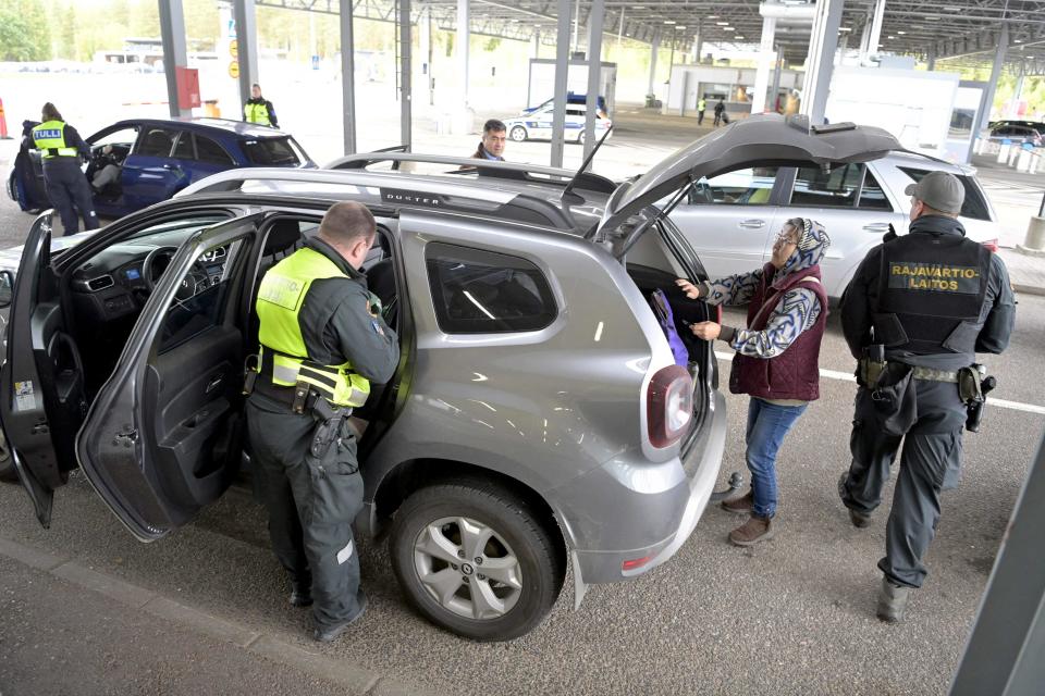 Finnish border guards check a Russian vehicle at the Vaalimaa border check point in Virolahti, Finland on Sunday (Lehtikuva/AFP/Getty)