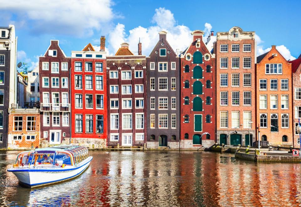 Amsterdam is renowned for its colourful canal houses (Getty)