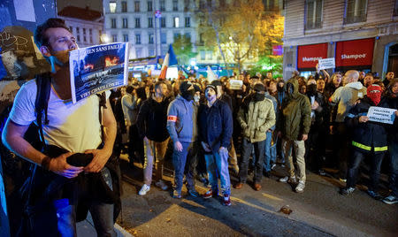 Several thousand police officers and firemen attend an unauthorised protest against anti-violence late in the night in Lyon, France, October 26, 2016. REUTERS/Robert Pratta