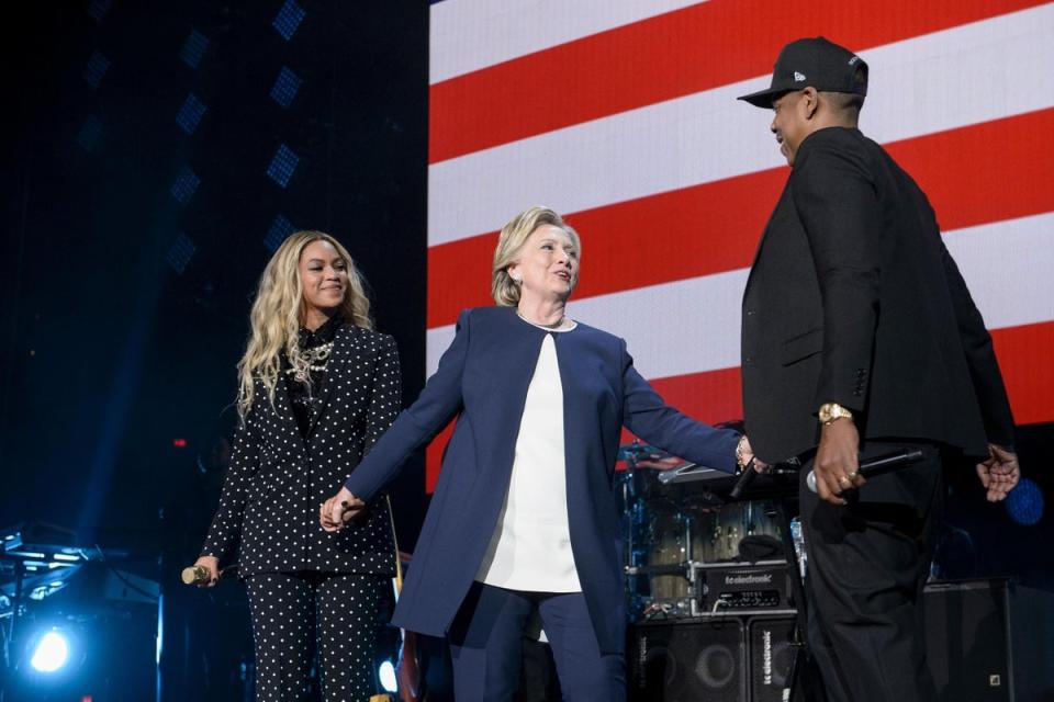 Democratic presidential nominee Hillary Clinton stands with Beyonce and Jay Z  during a Get Out the Vote (GOTV) performance, 2016 (AFP/Getty Images)